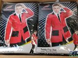 two red jackets in a cardboard box with a man in a suit