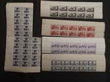 four different types of stamps on a black surface