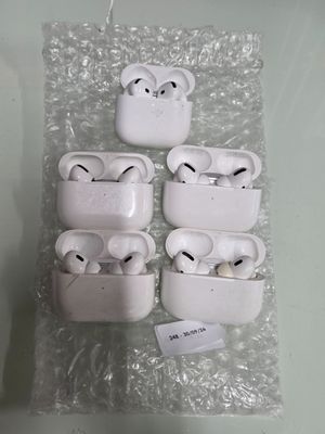 several airpods are wrapped in clear plastic on a table