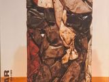 a picture of a pile of clothes on a wooden floor