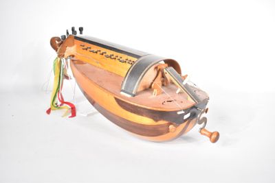 a small wooden boat with a string attached to it