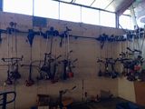 a lot of tools hanging on the wall in the garage