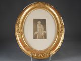 a picture of a picture of a man in a suit in a gold frame