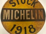 an old stock michel sign is displayed on a white surface