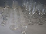 a lot of empty wine glasses sitting on a table