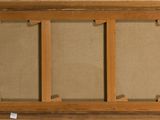 a close up of a picture of a window with a brown frame