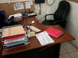 a desk with a lot of papers on it