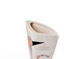 a white vase with a design on it on a white surface