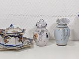 many different types of vases on a shelf