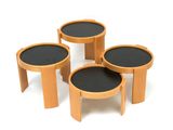 three round wooden tables with black tops sit on a white surface