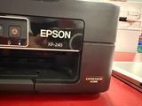 a printer that is sitting on a red counter
