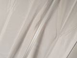 a metal pole that is sitting on a white sheet