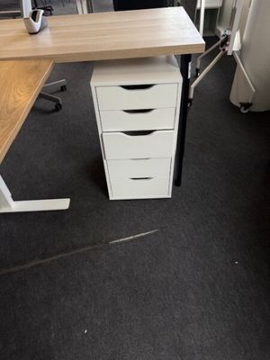 an image of a desk with a computer on top of it