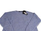 a close up of a blue sweater on a white background