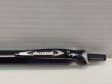 a pen that is laying on a table