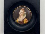 a picture of a woman in a black frame