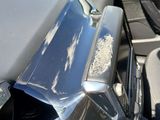 a close up of a car ' s front door handle