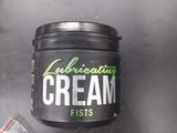 a close up of a container of cream next to a bag of nuts