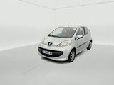 the small white car is parked in a white room