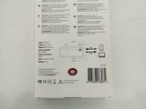 the back of a white box with a black and red sticker on it