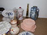many different types of plates and bowls on the table