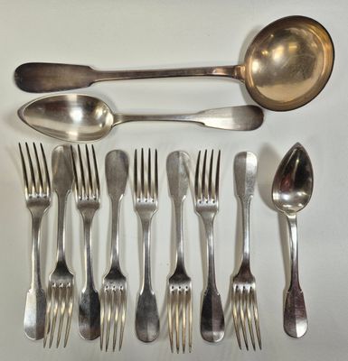 a lot of spoons, forks and spoons laid out on a table