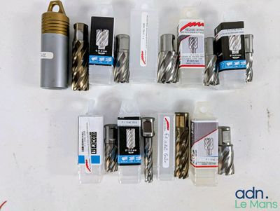 many different types of drill bits on the table