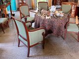a dining room with a table and chairs and a fireplace