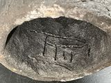 a close up of a piece of metal with writing on it