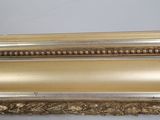 an image of a gold frame sitting on top of a white table