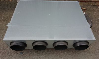 an image of a metal box with four black exhaust pipes