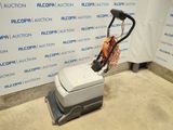 an image of a floor scruber in a room