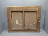 an old wooden frame with a rope hanging from it ' s side