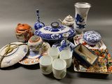 a lot of blue and white china on the table