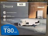 packaging of a robotic vacuum cleaner sitting on top of a cardboard box