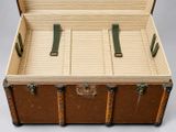 an old suitcase that is open on a white surface