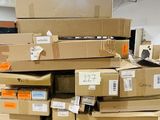 many boxes stacked on top of each other in a warehouse