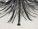 an image of a metal sculpture of a palm tree