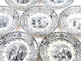 six black and white plates with pictures of people and animals on them