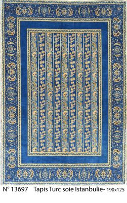 a blue rug with a floral design on it