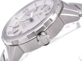 a close up of a watch on a white surface