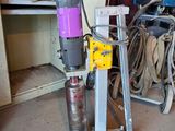 a machine that is sitting in a room with a lot of tools