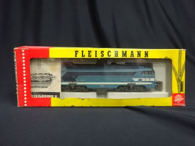 an image of a box with a blue and yellow train in it