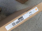 a box with a barcode on it sitting on the floor