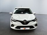 the front of a white car in a room with a black floor