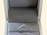 a white box with a ring inside of it