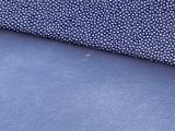 two pieces of blue fabric with small white dots on them