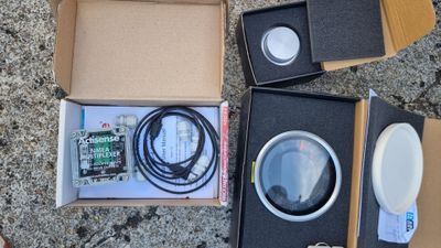 a box with a magnifying lens and a box with a magnifying lens in it