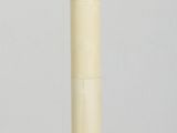 a white vase that is sitting on a wooden floor