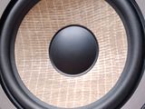 a close up of a speaker in a speaker box